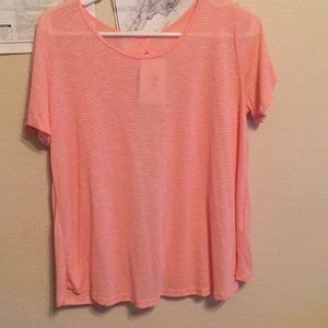 A peach twist back shirt
